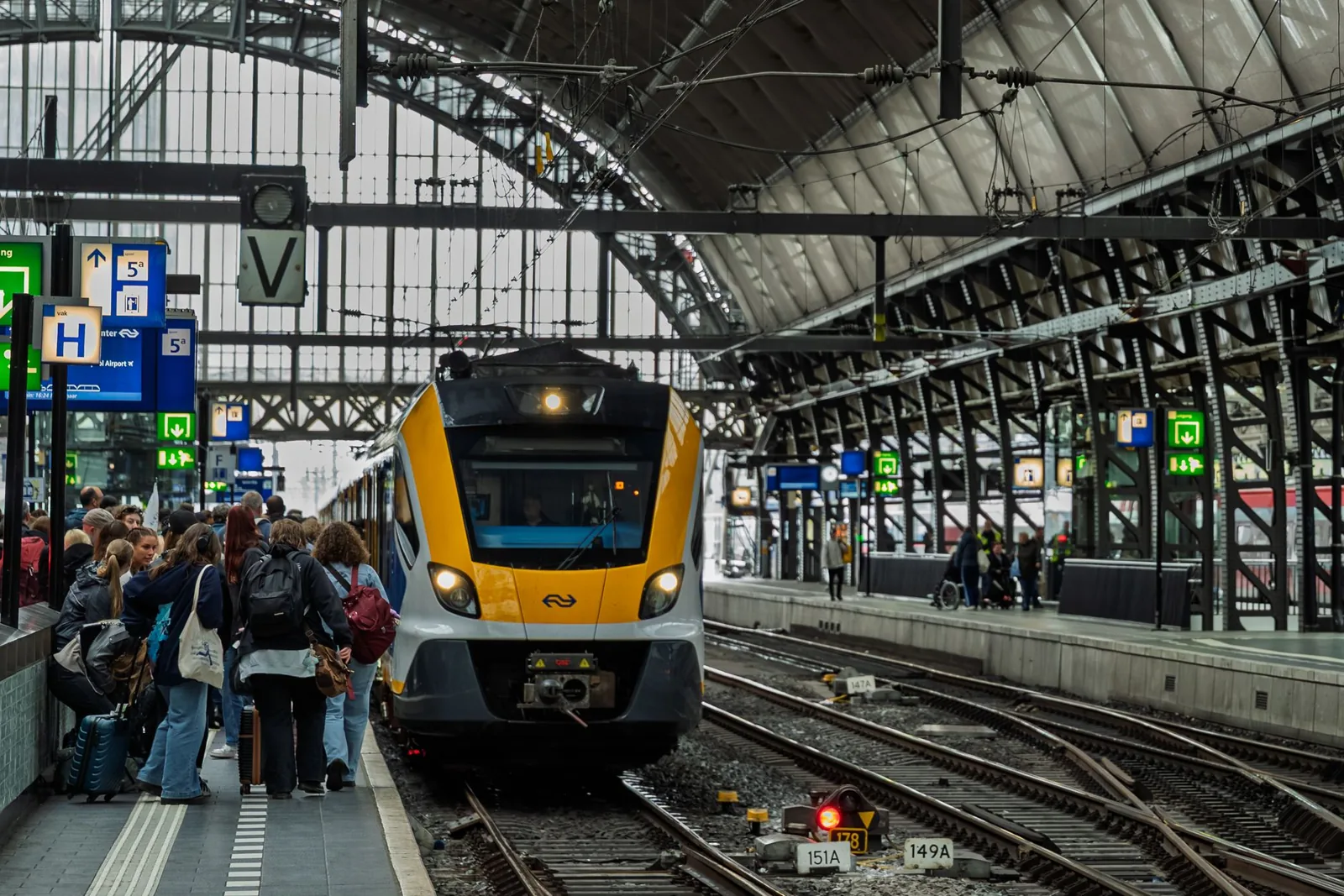 Passenger settling in with luggage on a long-distance train journey