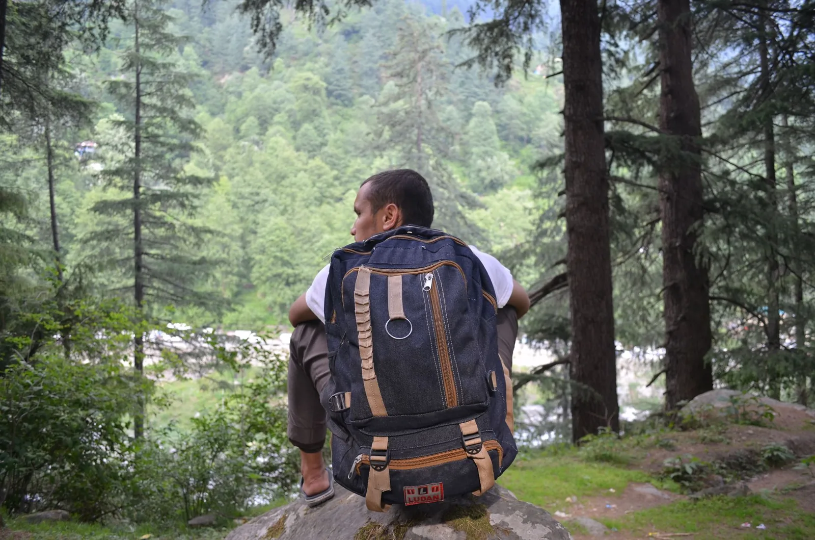 backpacker reading a map on a budget trip