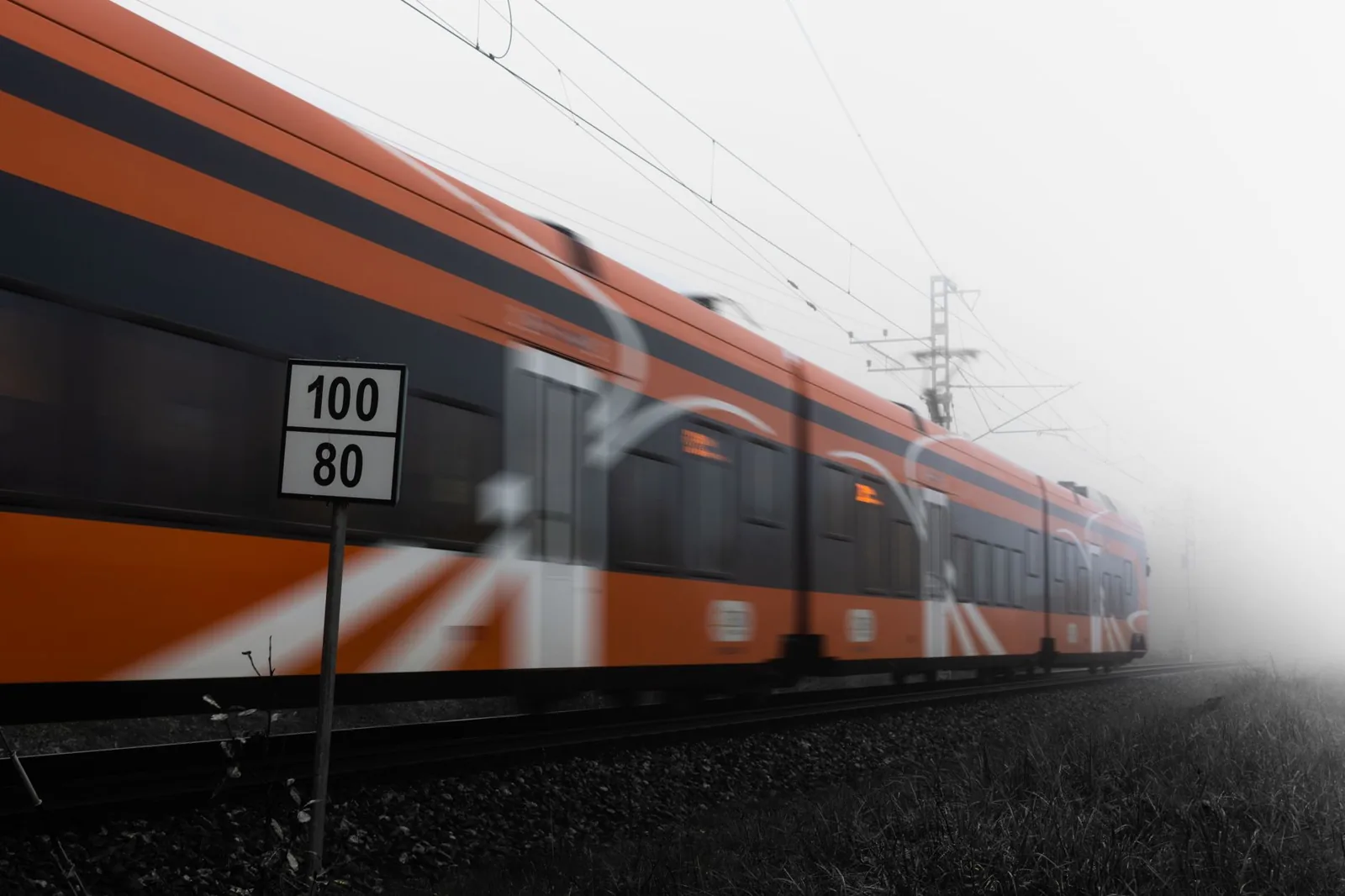 Passengers boarding a high speed train at a city-center station