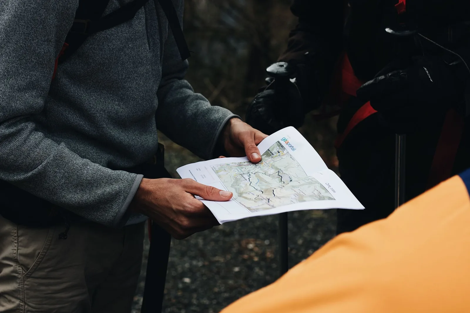 hiker planning a route with a map