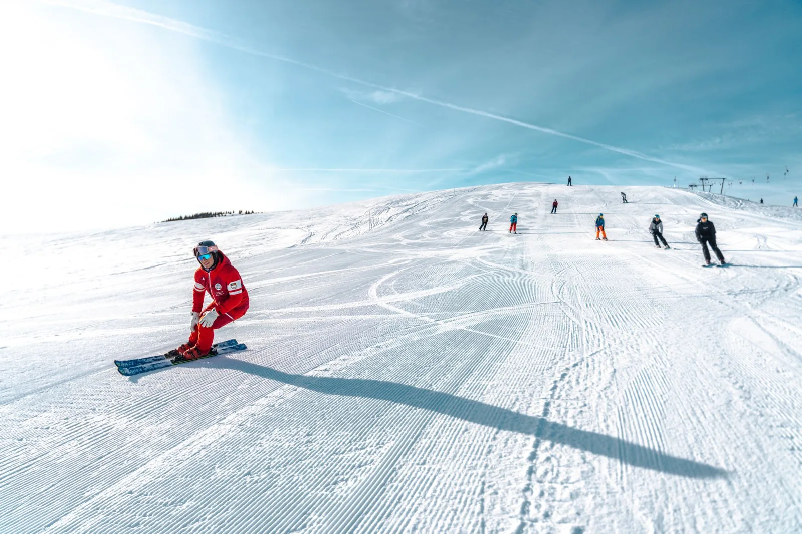 snowboarder inspecting a ski trail map at a mountain resort